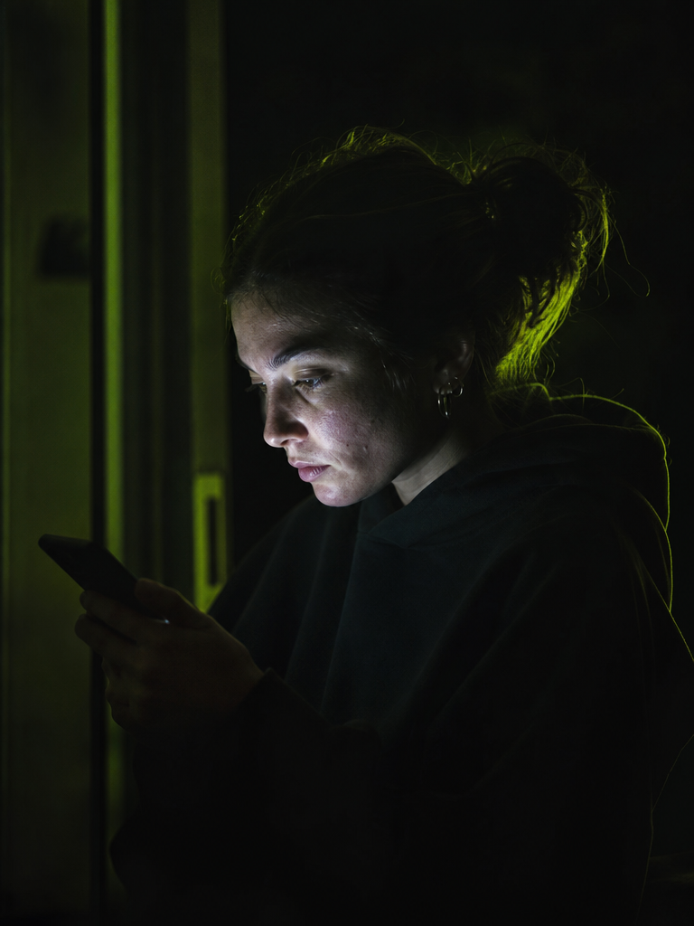 A suspect scrolling a phone
